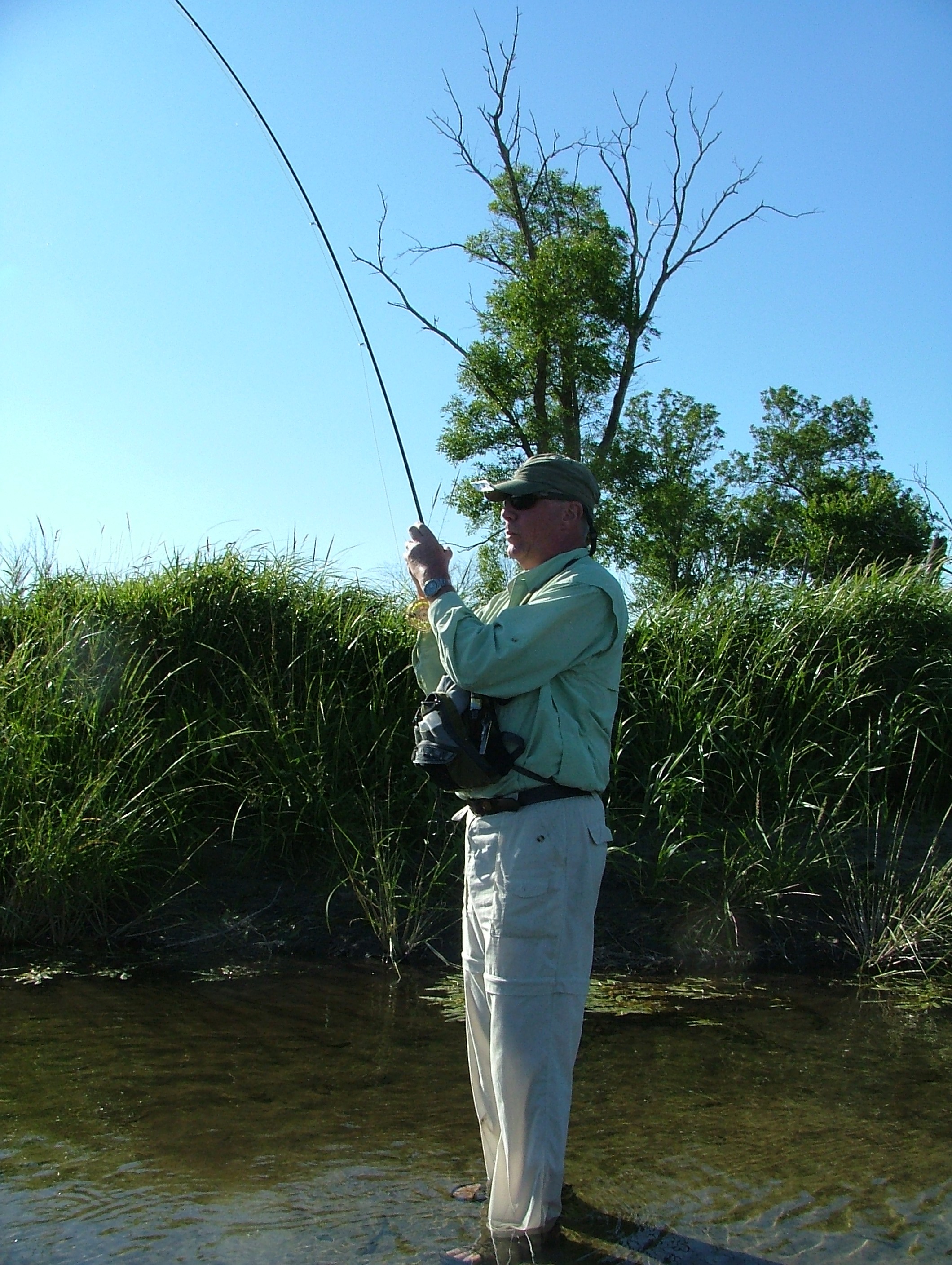 This angler is fighting a smallmouth directly from the reel